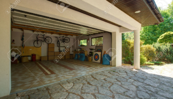 42198965-Carton-boxes-and-bikes-in-the-garage-Stock-Photo-garage-home-house