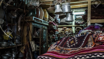 Antique Carpet and Copper Pots for Sale in an Antique Shop